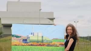 Artist Sarah Moncrieff with one of her paintings of Greatmoor